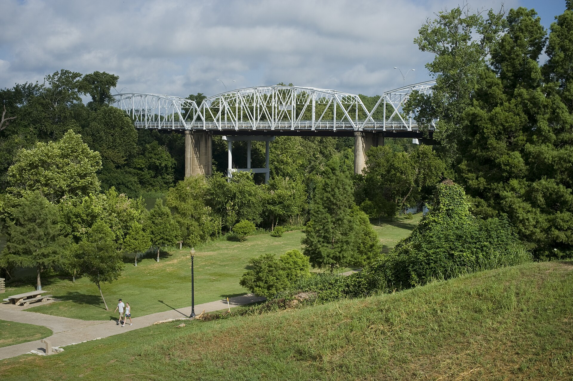 Historic Colorado River bridge and riverfront park in downtown Bastrop
